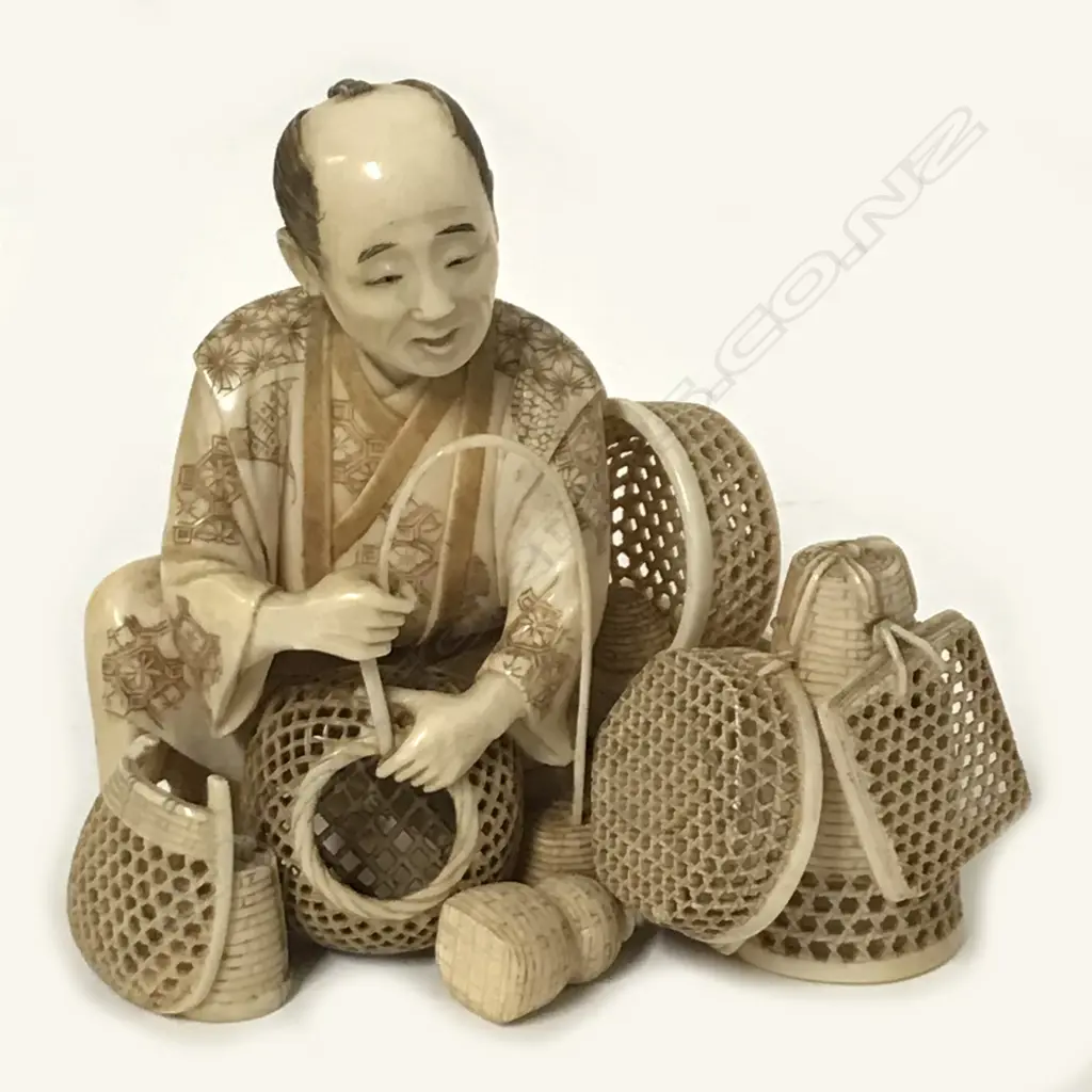 A fine Japanese ivory okimono of a basket maker Image 1++