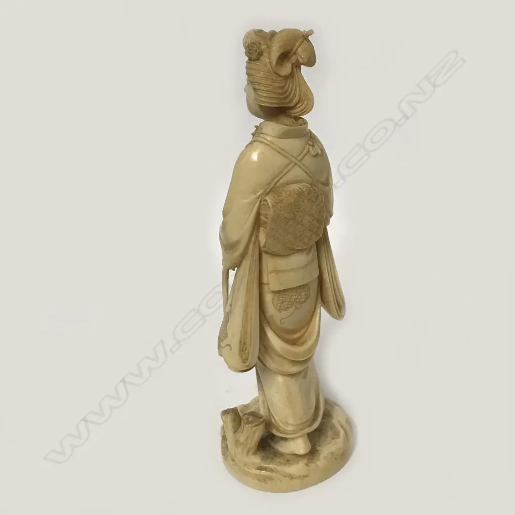 A Meiji period Japanese ivory carving of a woman Image 1++