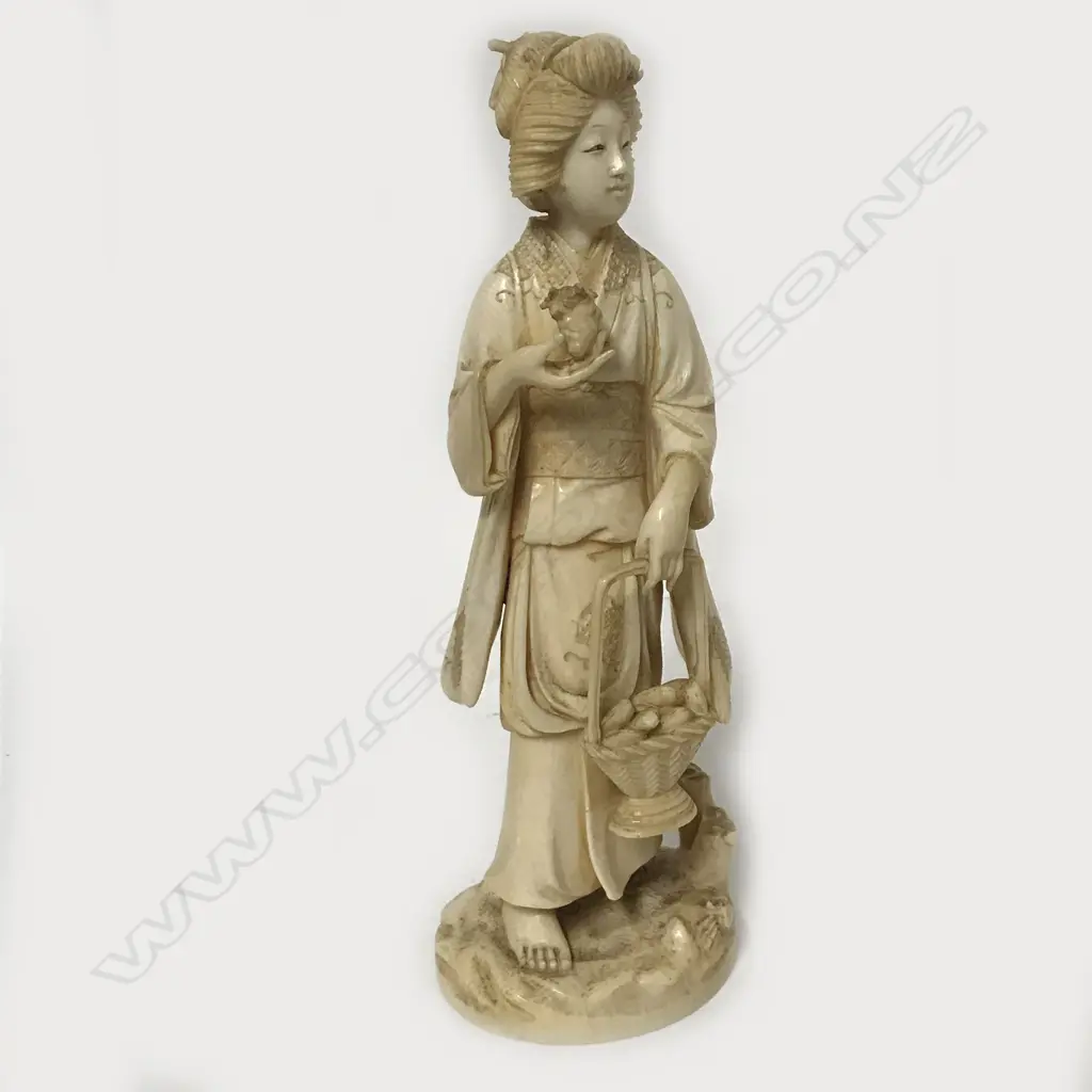 A Meiji period Japanese ivory carving of a woman Image 1++
