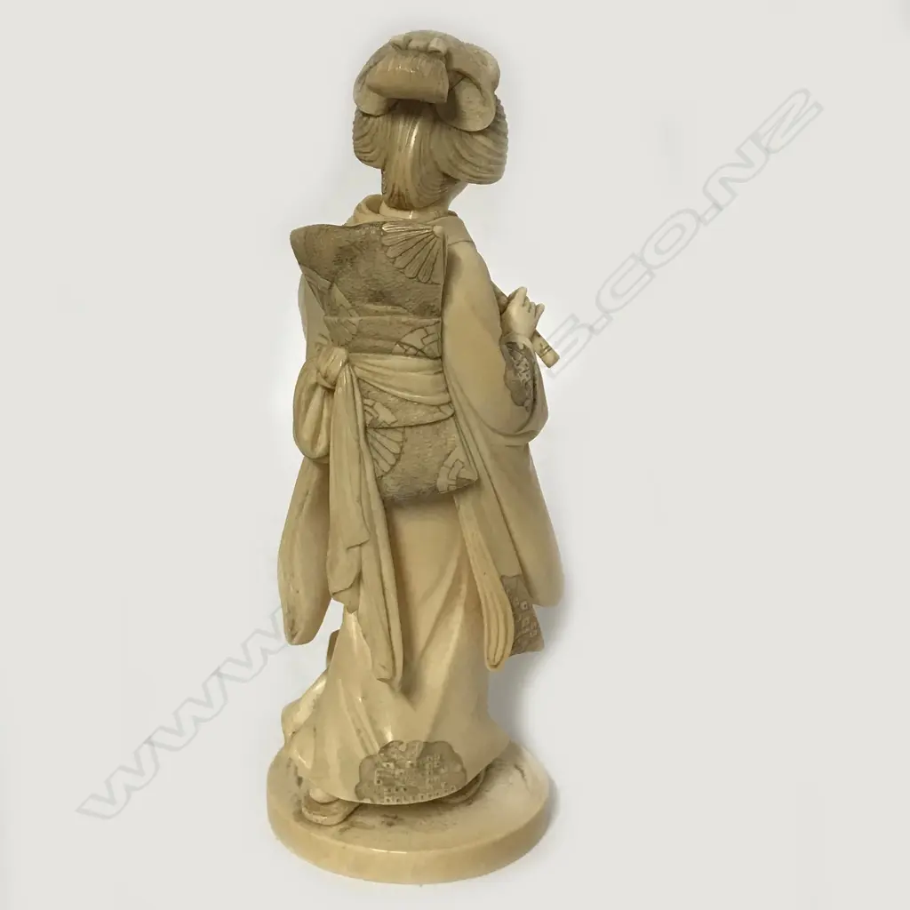 A Meiji period Japanese ivory carving of a woman Image 1++