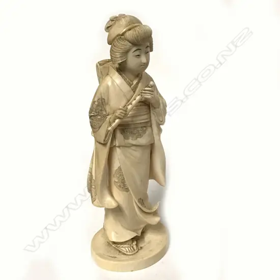 A Meiji period Japanese ivory carving of a woman