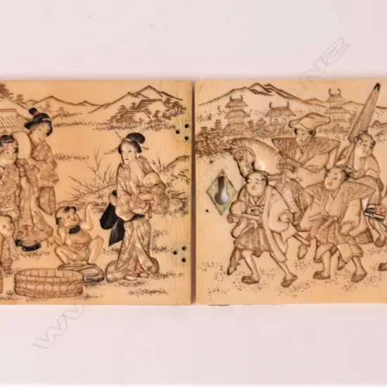 A pair of 19thC Japanese carved ivory door panels