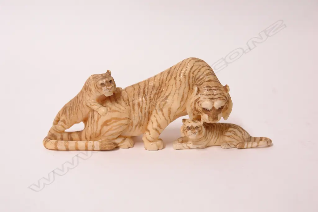 A Japanese Meiji period marine ivory carving of a tiger with her two cubs Image 1++
