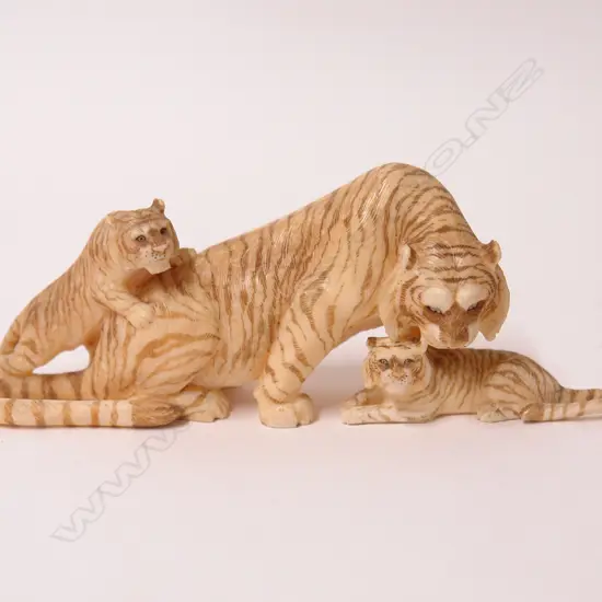 A Japanese Meiji period marine ivory carving of a tiger with her two cubs