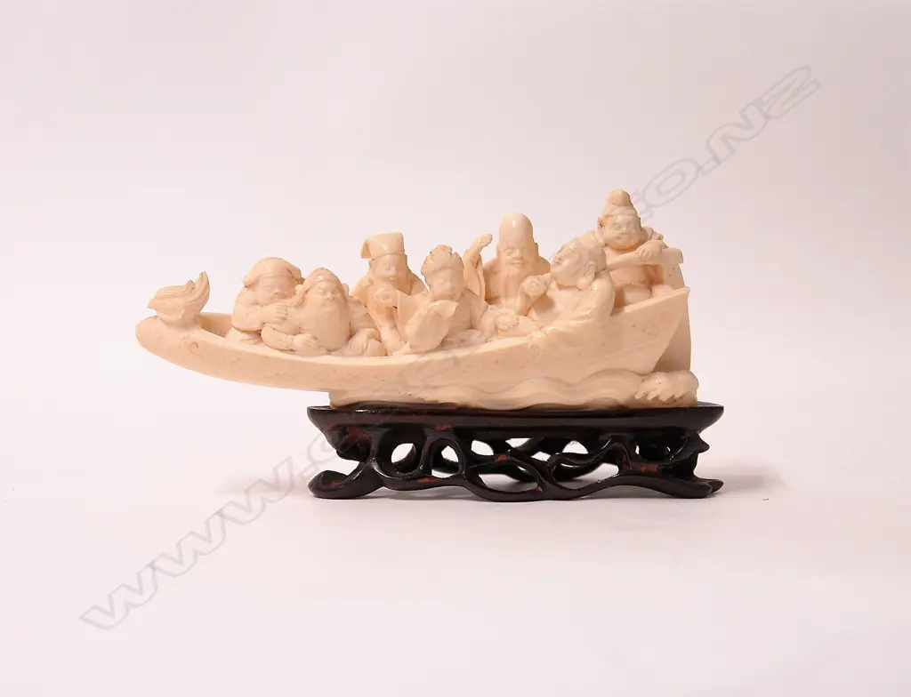 An early 20thC Japanese carved ivory figure group of the seven lucky gods aboard their takarabume Image 1++