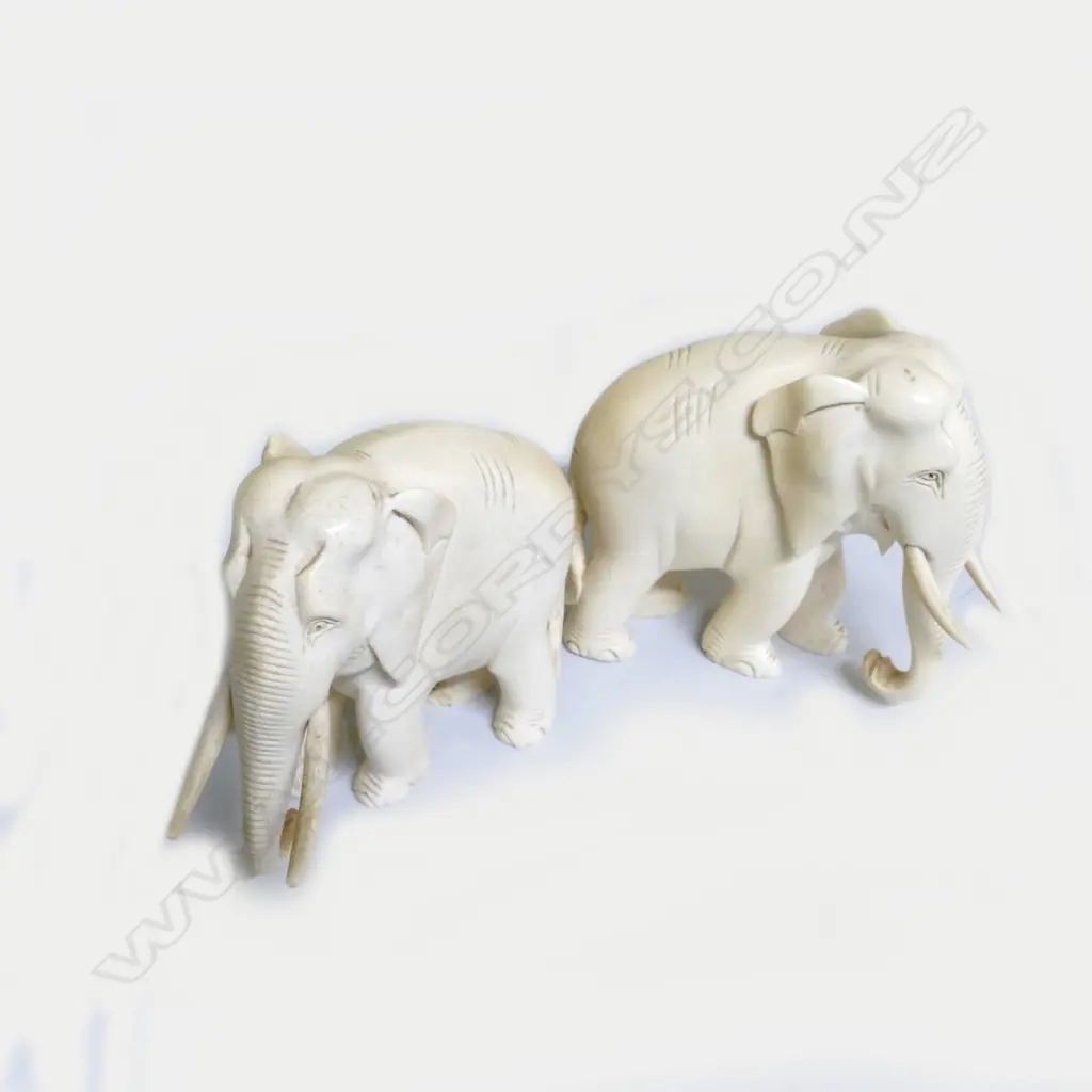 A pair of carved ivory standing elephants Image 1++