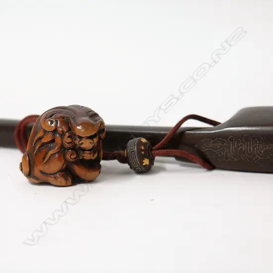 A 19thC Japanese bronze travelling pen and ink receptacle with attached 19thC carved boxwood shishi netsuke