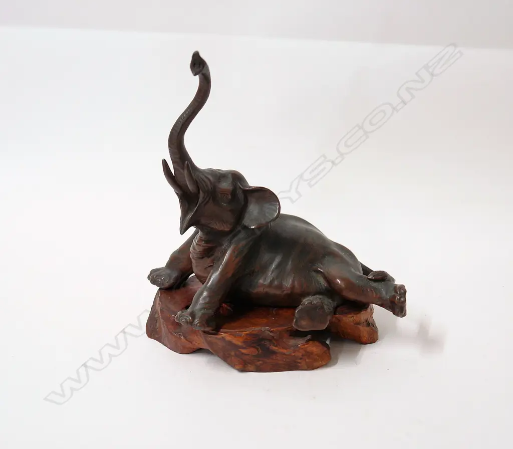 A Japanese Meiji bronzed spelter recumbent elephant Image 1++