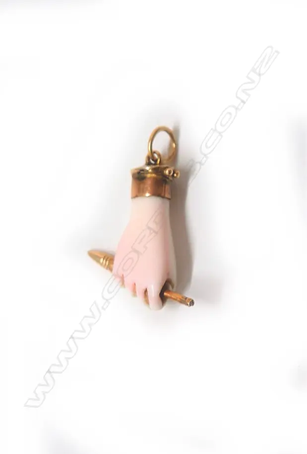 A 19thC carved pale pink coral and gold clasped hand pendant Image 1++