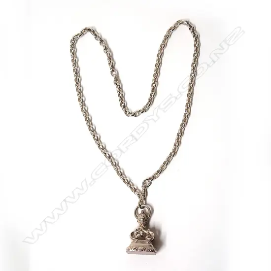 A decorative silver and agate gentleman's fob seal on silver chain