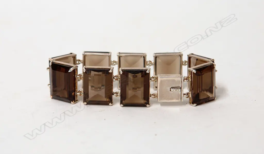 A modern smoky quartz and silver sectional bracelet Image 1++