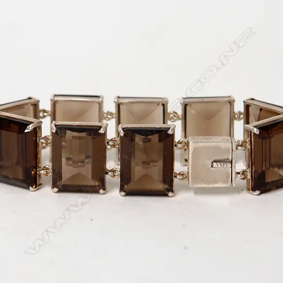 A modern smoky quartz and silver sectional bracelet