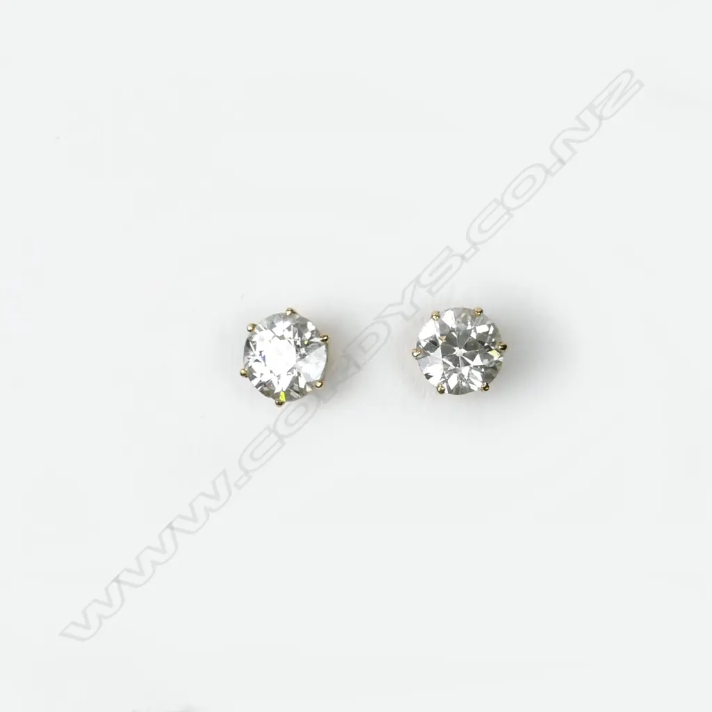 A pair of diamond stud earrings Image 1++