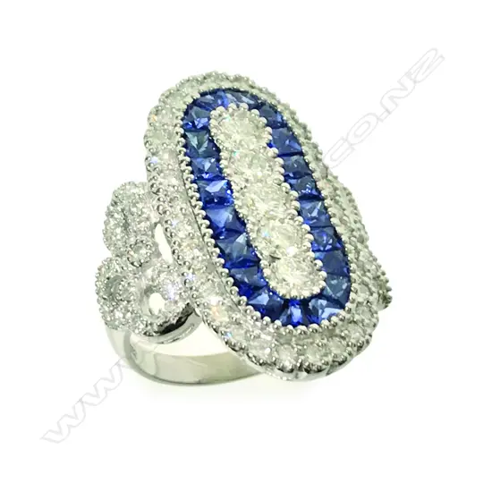 An 18ct. white gold sapphire and diamond dress ring