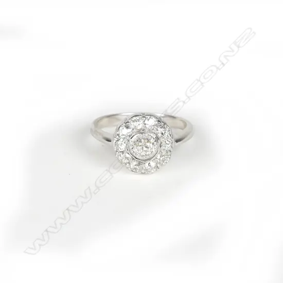 An estate 18ct. white gold diamond cluster ring