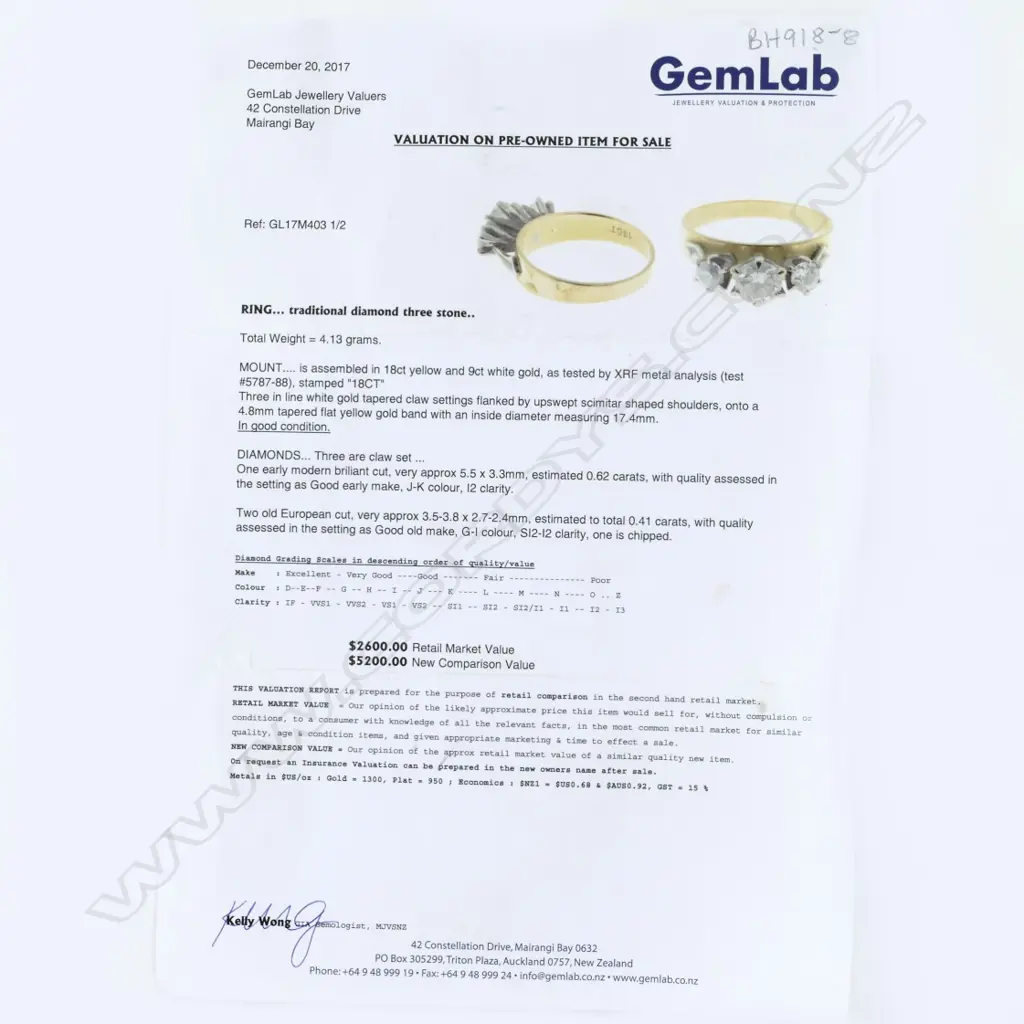 An estate 18ct. gold and three stone diamond ring Image 1++