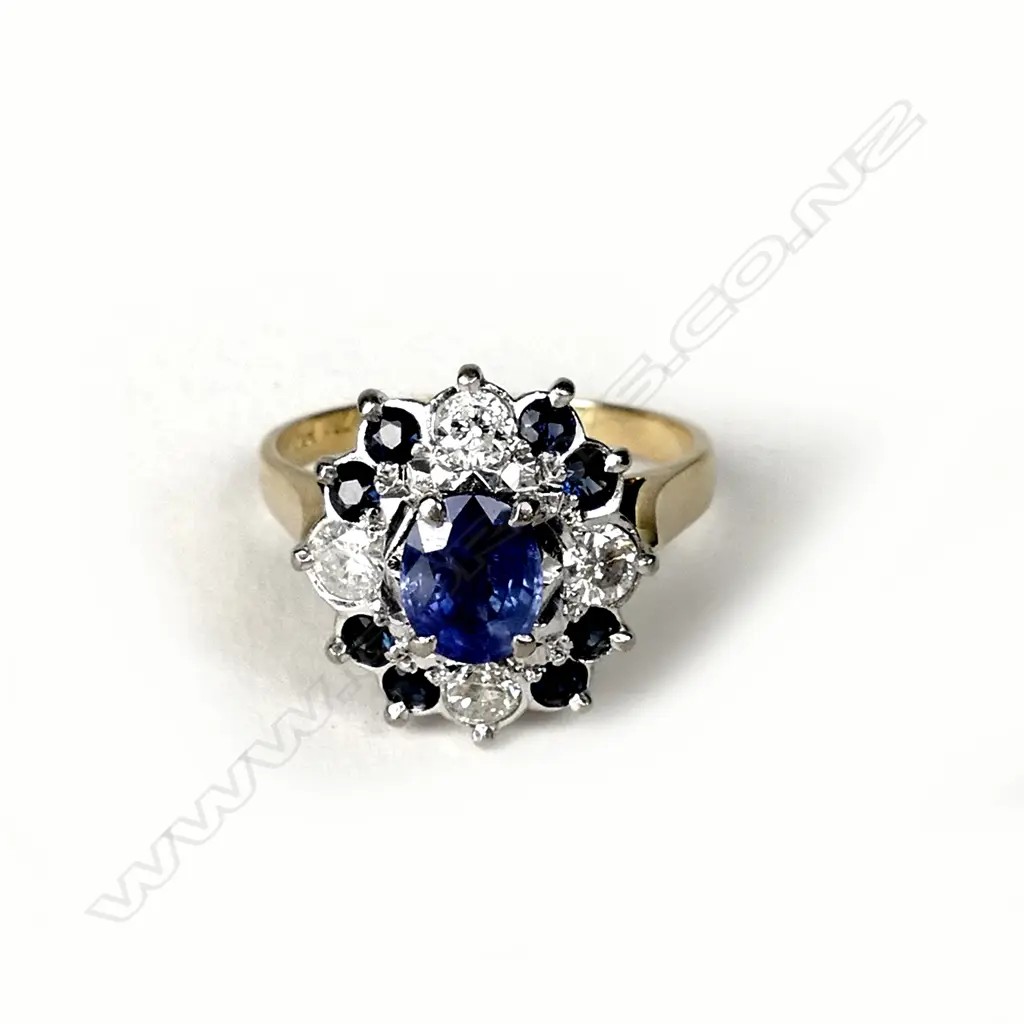 An 18ct gold diamond and sapphire ring Image 1++