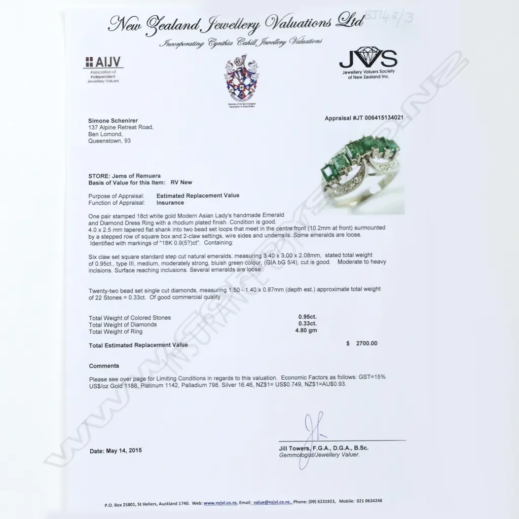 An 18ct. white gold emerald and diamond ring Image 1++