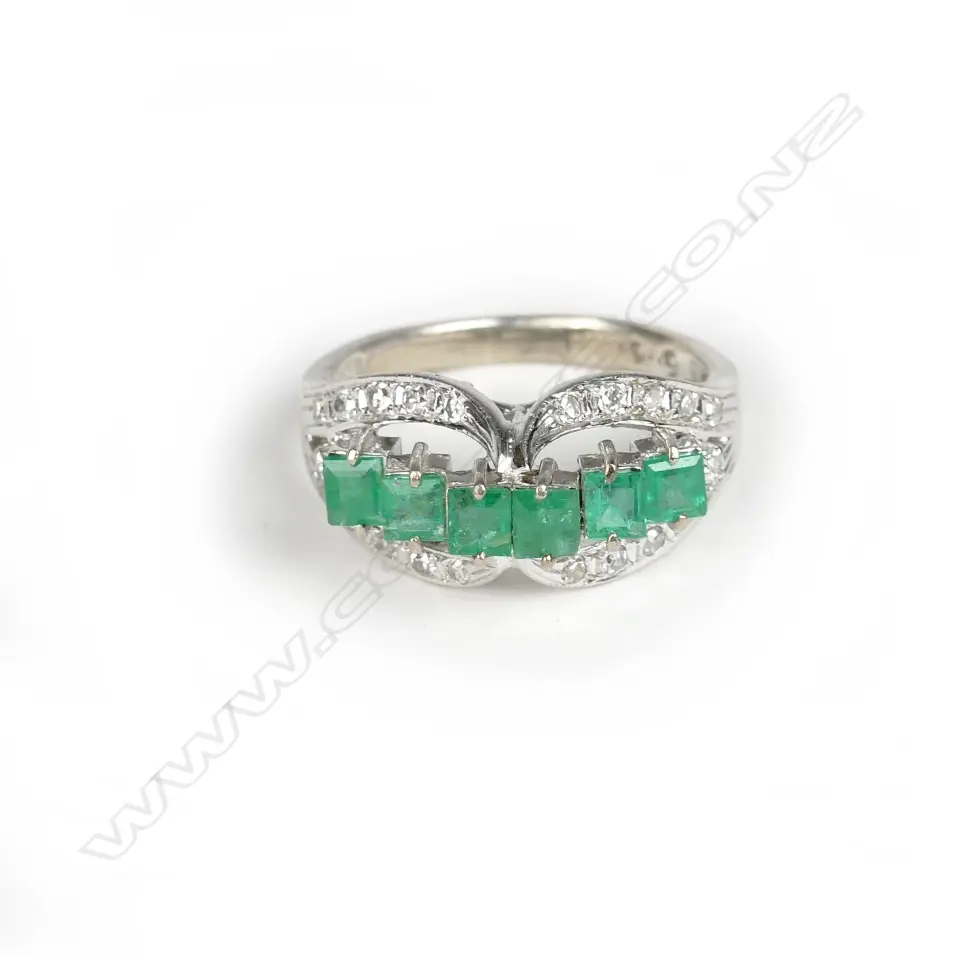 An 18ct. white gold emerald and diamond ring Image 1++