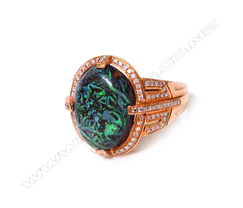 A modern 18ct. rose gold opal and diamond dress ring Image 1++