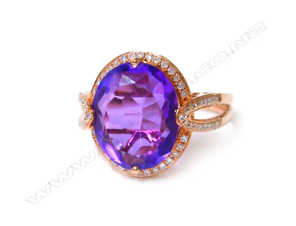 A modern 18ct. rose gold amethyst and diamond dress ring Image 1++