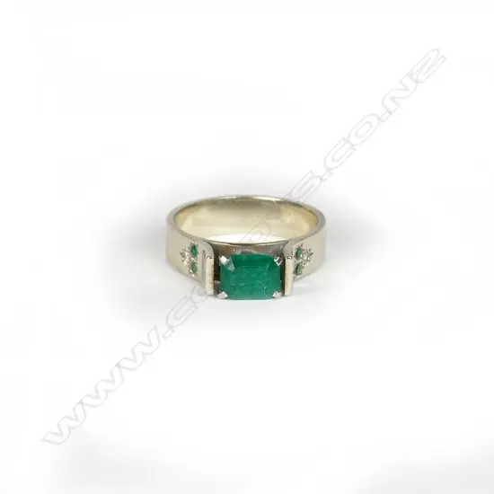 A palladium and emerald ring