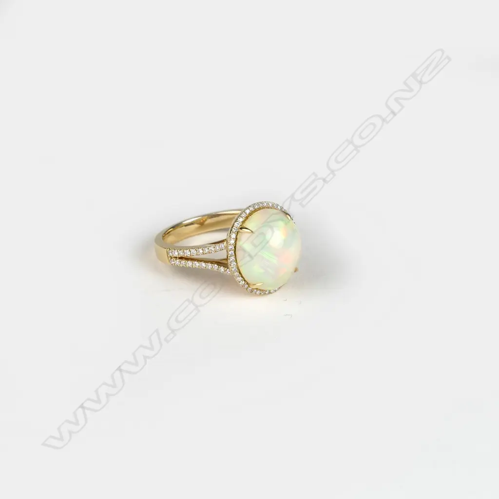 An 18ct. gold opal and diamond ring Image 1++
