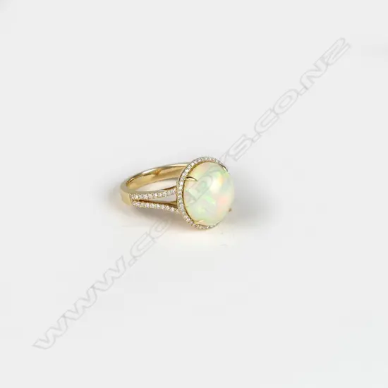 An 18ct. gold opal and diamond ring