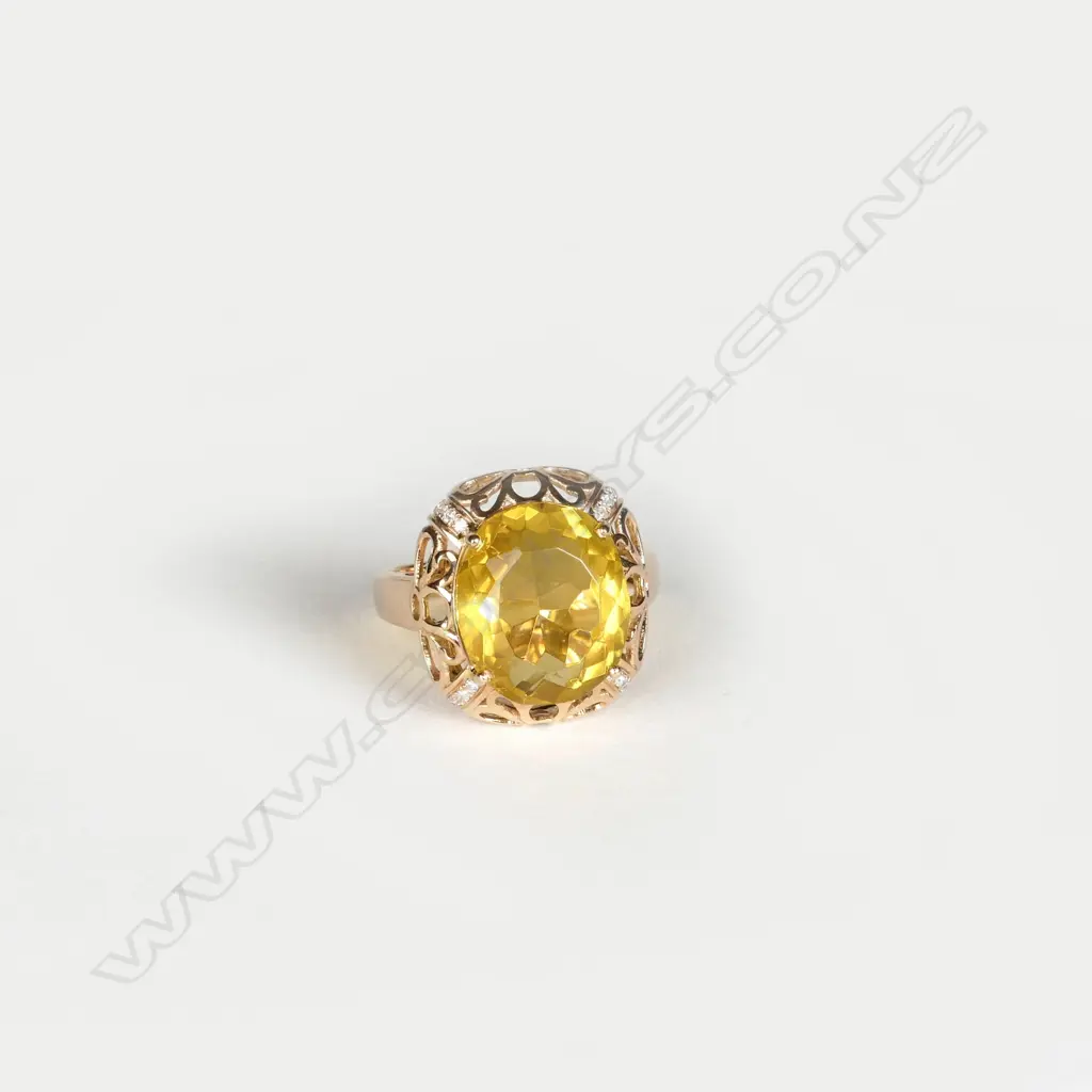 An 18ct. yellow gold large citrine and diamond dress ring Image 1++