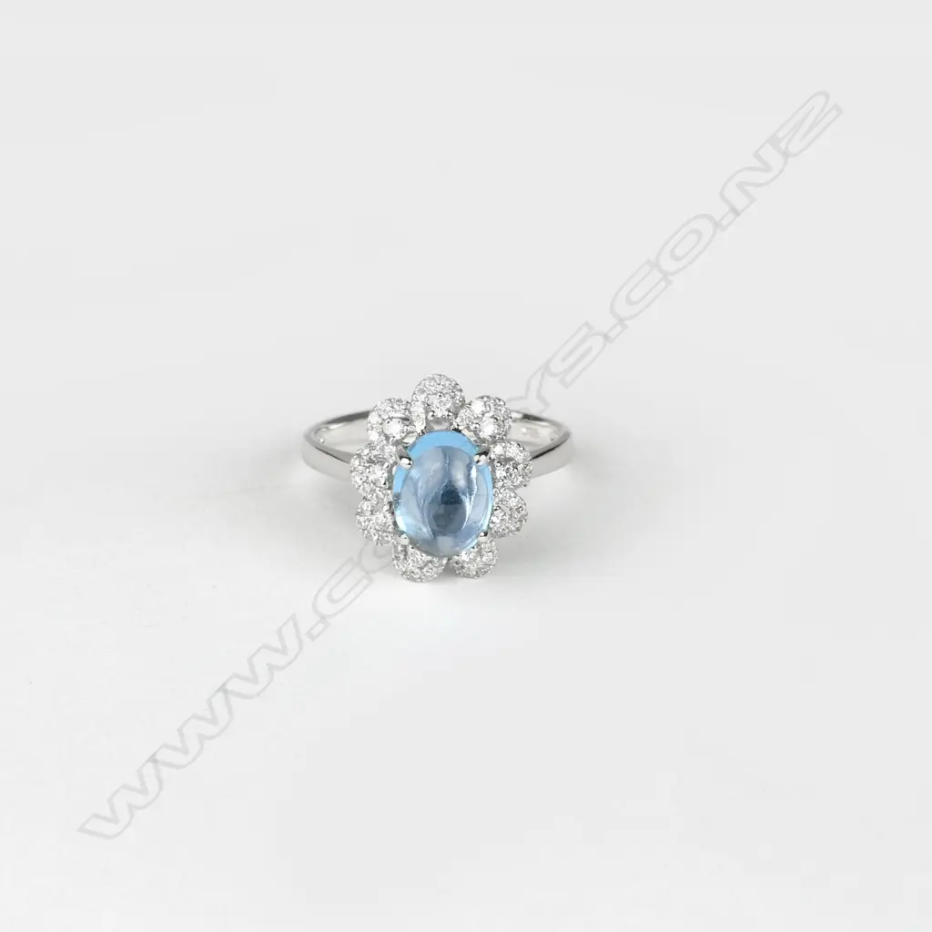 A modern 18ct. white gold topaz and diamond dress ring Image 1++