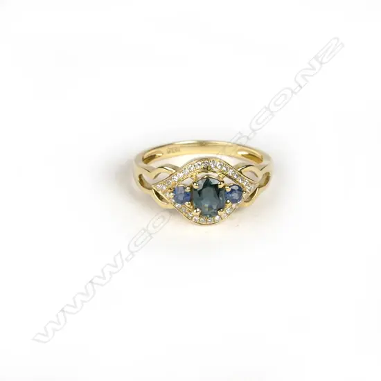 An 18ct. yellow gold sapphire and diamond ring