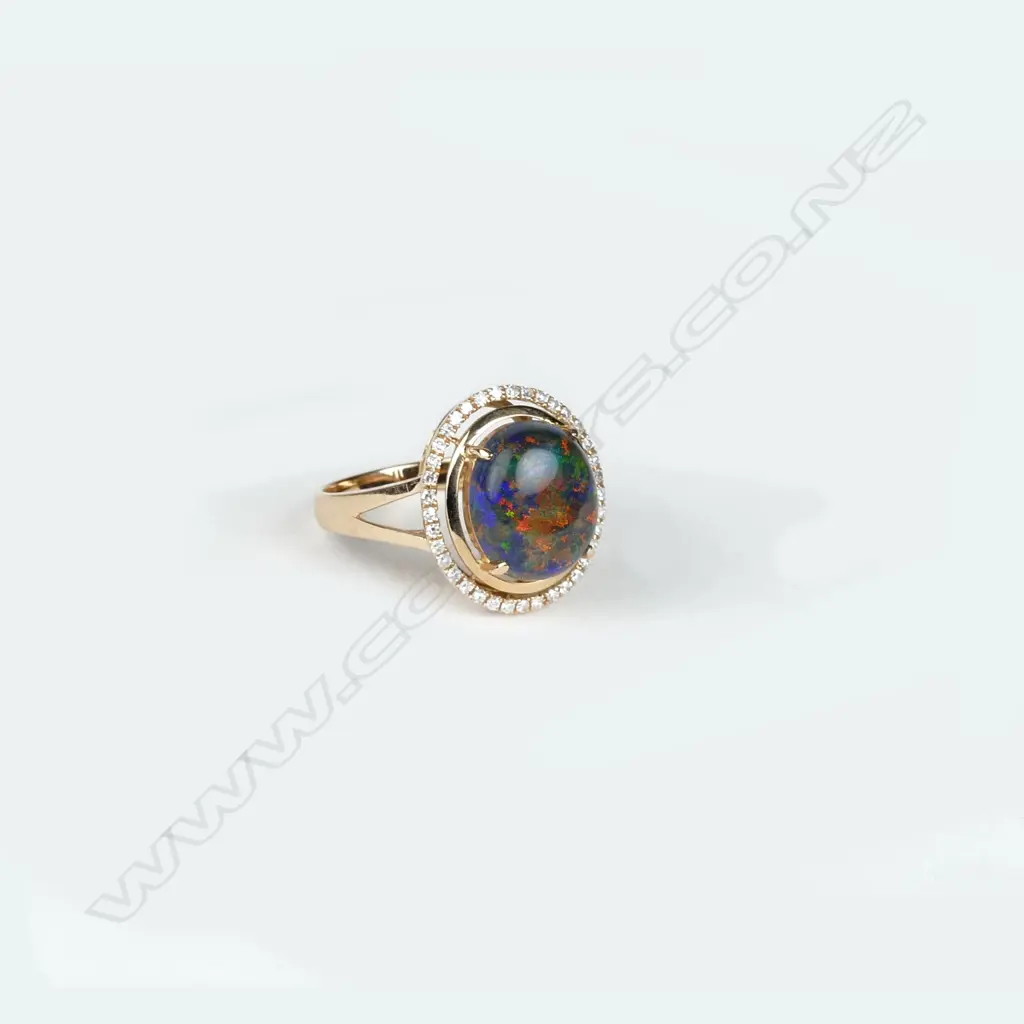 An 18ct. rose gold black opal and diamond dress ring Image 1++
