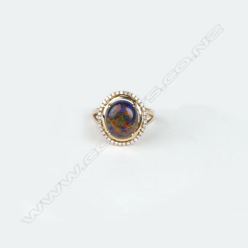 An 18ct. rose gold black opal and diamond dress ring Image 1++