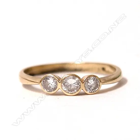 An estate 18ct. yellow gold and three stone diamond ring