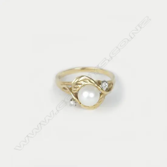 A 14ct. gold diamond and pearl ring