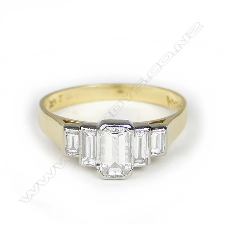 An 18ct. gold and five stone diamond ring Image 1++