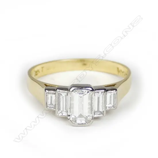 An 18ct. gold and five stone diamond ring