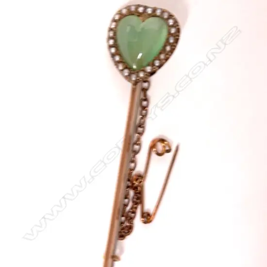An Edwardian 9ct. greenstone and seed pearl brooch
