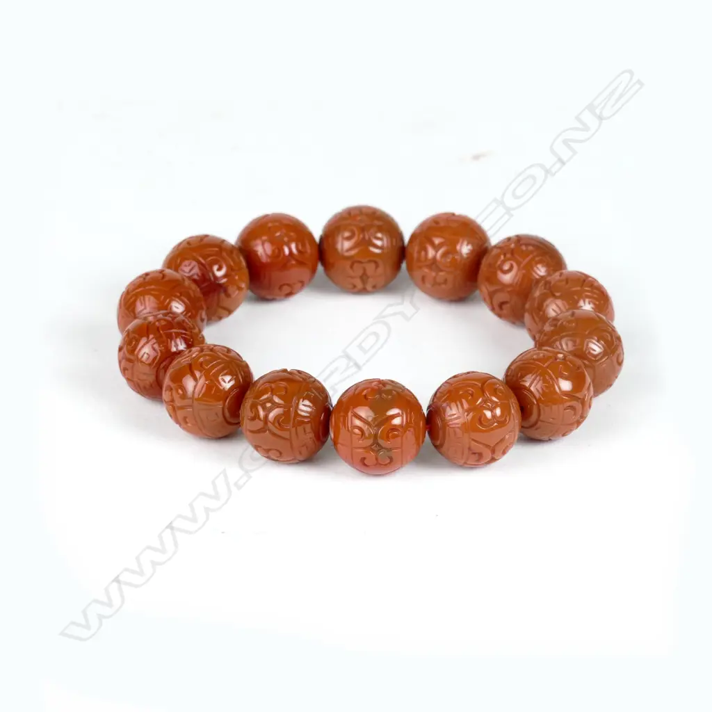 A Chinese carved orange agate bead bracelet Image 1++