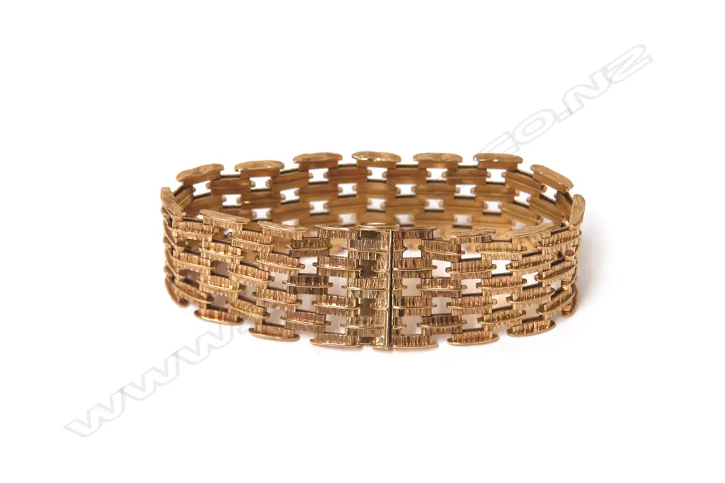 A retro English made 9ct. yellow gold wide bracelet Image 1++