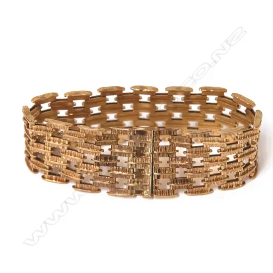 A retro English made 9ct. yellow gold wide bracelet