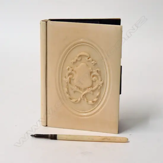 A Victorian ivory covered card case