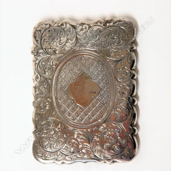 A silver leaf scroll engraved card case