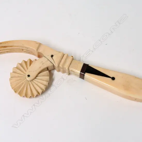 A 19thC marine ivory bone and tortoiseshell pastry wheel
