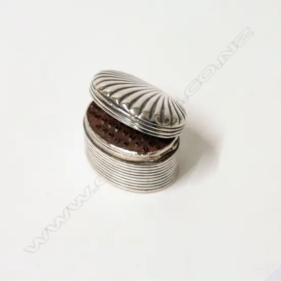 A George III silver shell top nutmeg grater