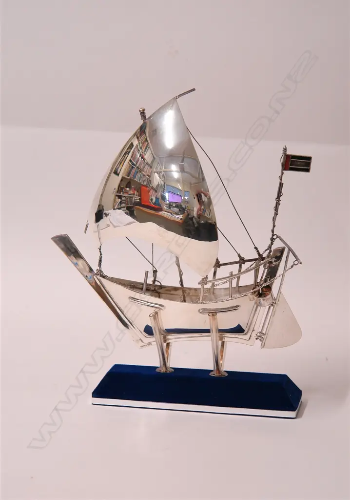 An Eastern silver model sailboat on stand Image 1++