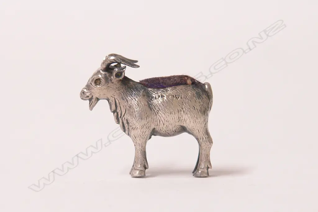 A rare early 20thC silver pin cushion modelled as a standing goat Image 1++