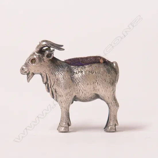 A rare early 20thC silver pin cushion modelled as a standing goat