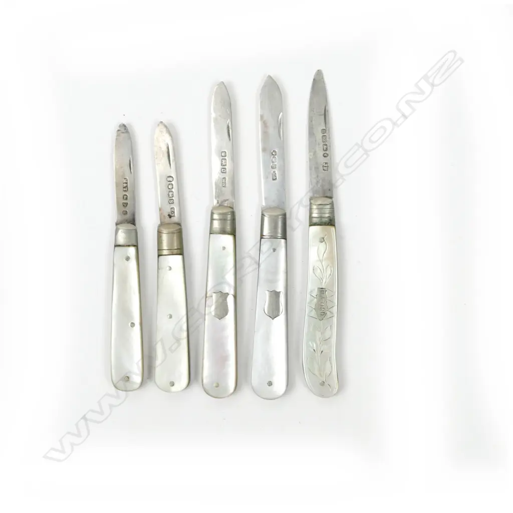 A collection of five mother-of-pearl and silver folding fruit knives Image 1++
