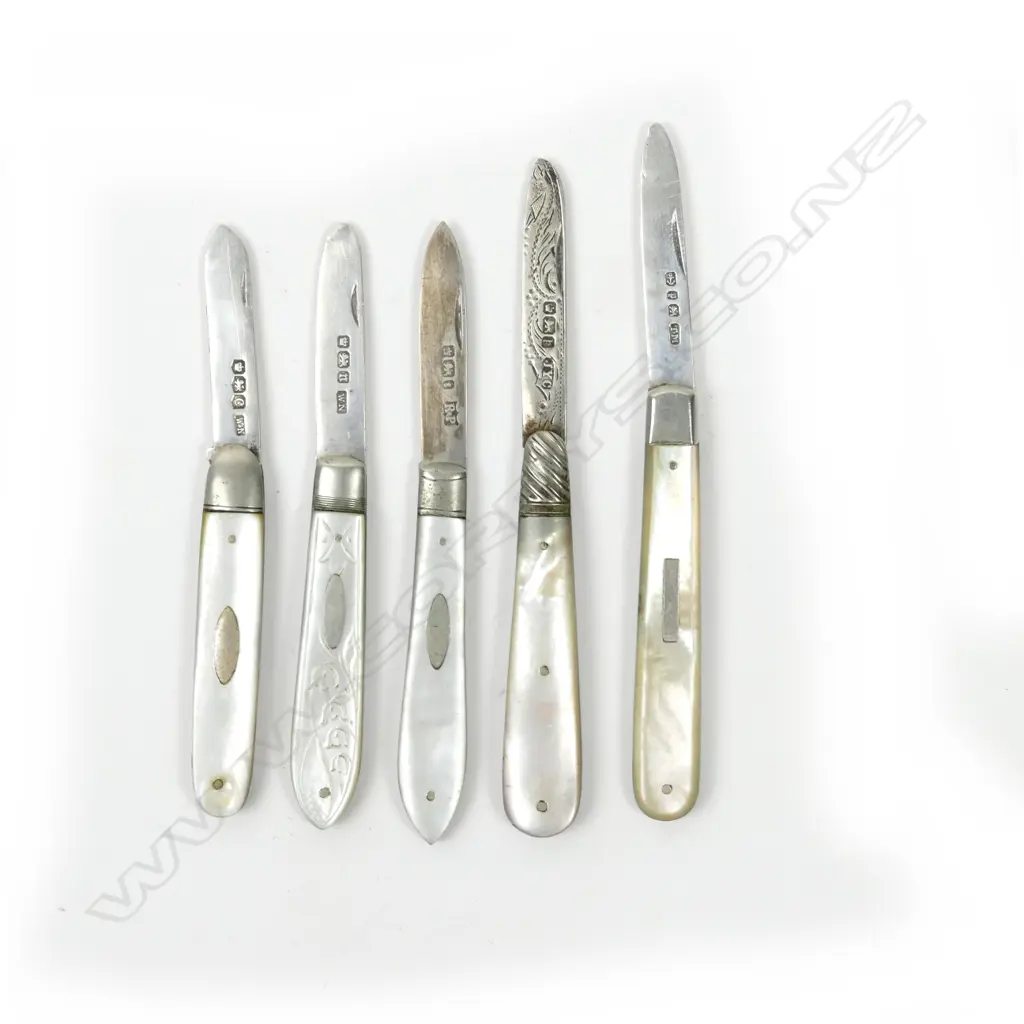 A collection of five mother-of-pearl and silver folding fruit knives Image 1++